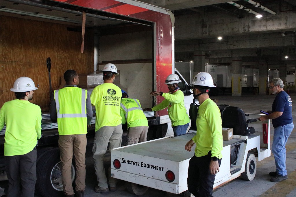 Grassland apprentices unloading material